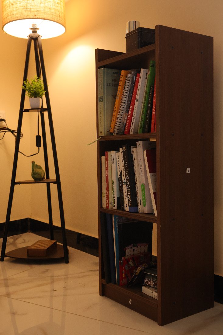 My bookshelf under warm lamplight